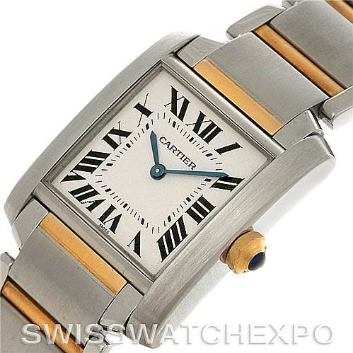 The Cartier Tank Francaise W51007Q4 Women's Steel and Gold (two tone) Silver Dial W51007Q4 Women's Steel and Gold (two tone) Silver Dial watch is shown at an angled view highlighting its face, bracelet, and crown with a sapphire cabochon.