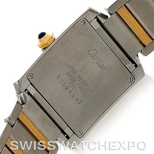 This image shows the back case and part of the metal bracelet of a Cartier Tank Francaise W51007Q4 Women's Steel and Gold (two tone) Silver Dial W51007Q4 Women's Steel and Gold (two tone) Silver Dial watch, highlighting its inscriptions and details.