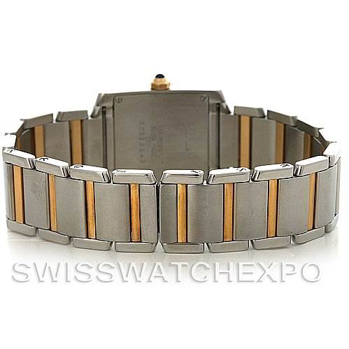 The image shows a rear view of the Cartier Tank Française model watch, highlighting its two-tone bracelet and case back.