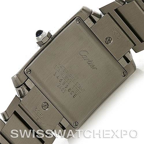 The image displays the back of a Cartier Tank Française watch, highlighting the stainless steel case and part of the bracelet.