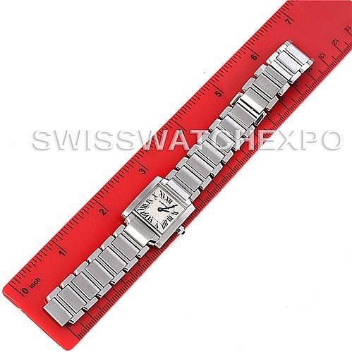 The Cartier Tank Francaise W51008Q3 Women's Stainless Steel White Dial W51008Q3 Women's Stainless Steel White Dial watch is laid flat beside a red ruler for size comparison, showcasing its full band and face.