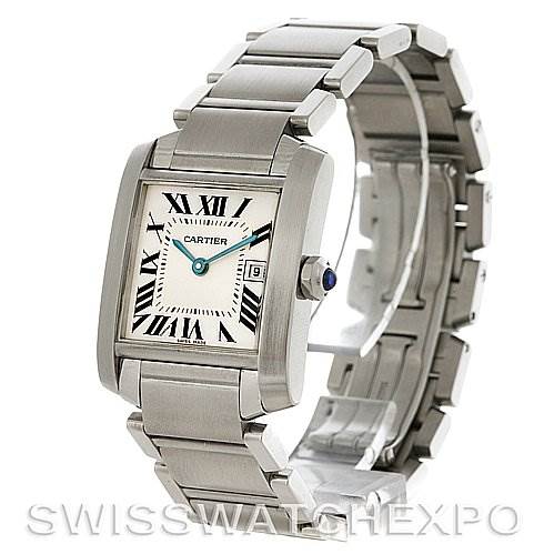 The Cartier Tank Française watch is shown at an angle displaying the face, bracelet, and crown with a blue cabochon.