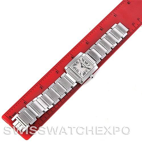 This image shows a Cartier Tank Francaise W51011Q3 Women's Stainless Steel Silver Dial W51011Q3 Women's Stainless Steel Silver Dial watch laid flat, with the entire bracelet and watch face visible against a red ruler for scale.