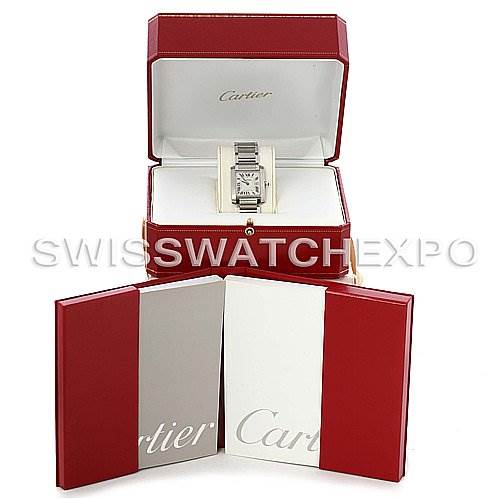 This image shows a Cartier Tank Française watch in its open red case, accompanied by manuals and packaging, viewed from the front.