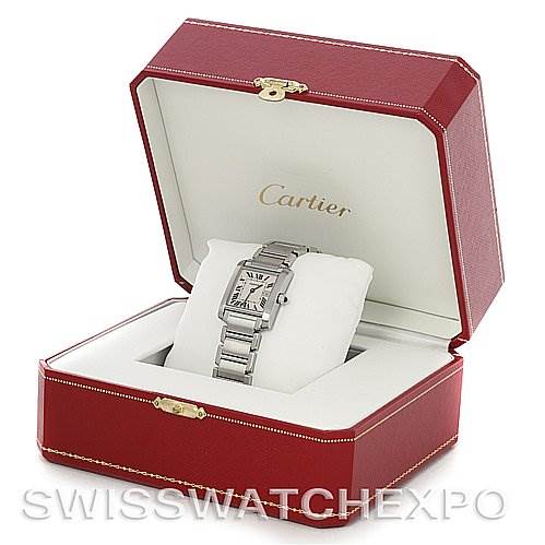 The image shows a Cartier Tank Française wristwatch, placed at an angle in its open red presentation box.