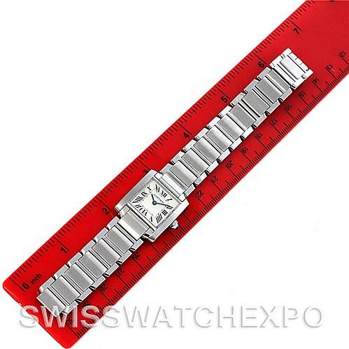 The image shows a top-down view of a Cartier Tank Francaise W51008Q3 Women
s Stainless Steel Silver Dial W51008Q3 Women
s Stainless Steel Silver Dial watch laid out along a red ruler for scale.