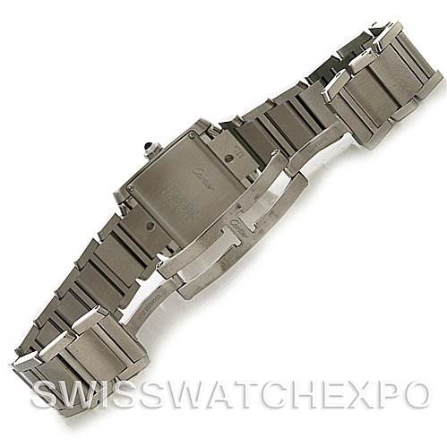The image shows the back and bracelet of a Cartier Tank Française watch, highlighting the clasp and links of the stainless steel band.