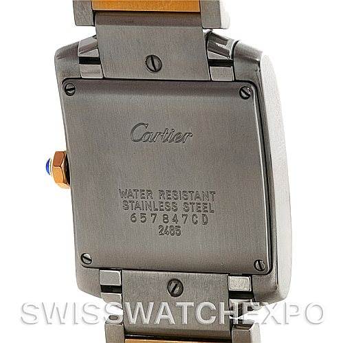 The image shows the back case and bracelet of the Cartier Tank Française watch, highlighting the brand engraving and model details.