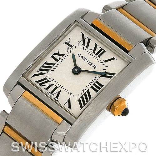 This is an image of a Cartier watch showing the face, part of the band, and the crown from an angled perspective.