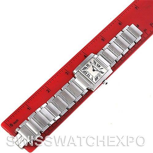 The image shows a Cartier Tank Francaise W51011Q3 Women's Stainless Steel Silver Dial W51011Q3 Women's Stainless Steel Silver Dial watch laid flat with its face and metal bracelet fully visible, next to a red ruler for scale.