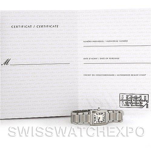 The image shows a Cartier Tank Francaise W51008Q3 Women
s Stainless Steel Silver Dial W51008Q3 Women
s Stainless Steel Silver Dial watch laying flat with its certificate displayed behind it.