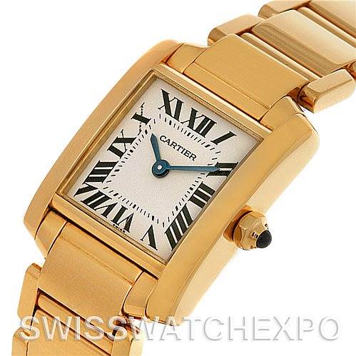 This image shows a close-up angle of a Cartier Tank Francaise W50002N2 Women's Yellow Gold Silver Dial W50002N2 Women's Yellow Gold Silver Dial watch, highlighting its face, crown, and part of the bracelet.