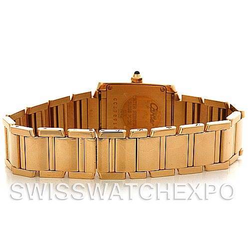 This image shows the back of the Tank Francaise watch by Cartier and a portion of the gold bracelet.