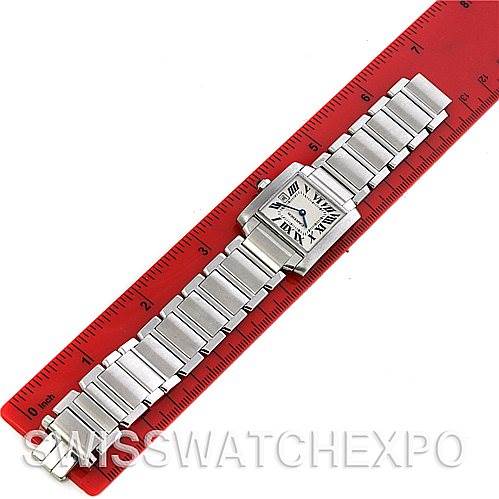 The image shows a Tank Francaise model by Cartier laid flat next to a red ruler.