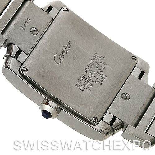 The image shows the case back, crown, and part of the stainless steel bracelet of a Cartier Tank Française watch.