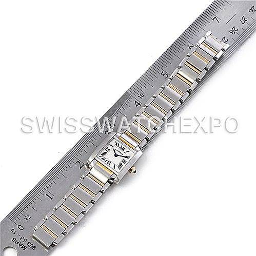 The image shows a Cartier Tank Francaise W51007Q4 Women's Steel and Gold (two tone) Silver Dial W51007Q4 Women's Steel and Gold (two tone) Silver Dial watch laid flat on a ruler, displaying its rectangular face and metal bracelet.