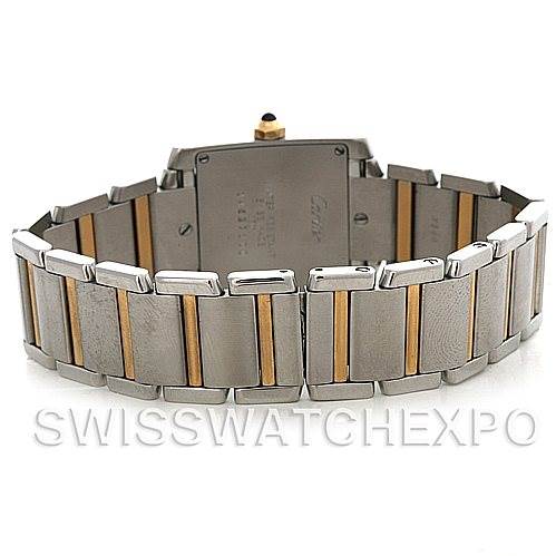 The image shows the back view of a Cartier Tank Française watch, highlighting its bracelet with stainless steel and gold accents.