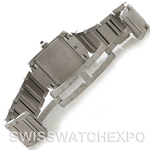 The image shows the back case and open metal bracelet of the Cartier Tank Française watch from a top angle.