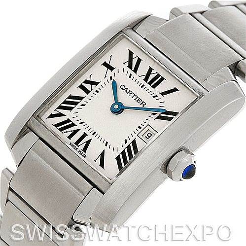 The image shows a close-up of the Cartier Tank Française watch from an oblique angle, highlighting its face, crown, and part of the bracelet.
