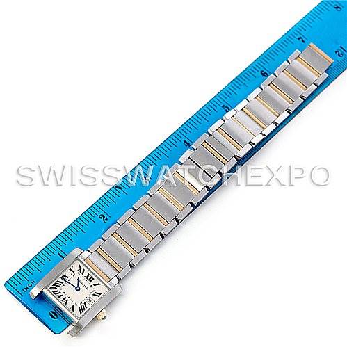 The Cartier Tank Francaise W51012Q4 Women's Steel and Gold (two tone) Silver Dial W51012Q4 Women's Steel and Gold (two tone) Silver Dial watch is shown flat alongside a ruler, highlighting its stainless steel bracelet and rectangular face.