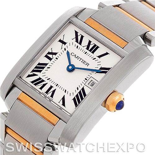 This image shows a Cartier Tank Française watch at an oblique angle, highlighting its dial, crown, and part of the band.