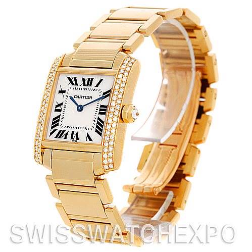 This is a Cartier Tank Francaise WE1017R8 Women's Yellow Gold Silver Dial WE1017R8 Women's Yellow Gold Silver Dial watch shown at an angled view, displaying the face, bracelet, and diamond-studded case.