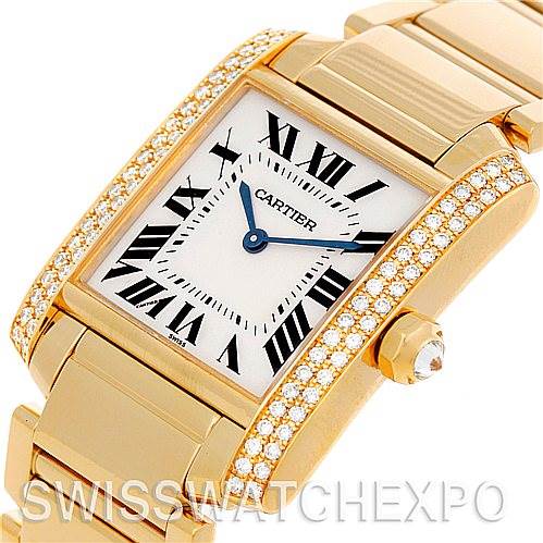 The image shows the Cartier Tank Francaise WE1017R8 Women's Yellow Gold Silver Dial WE1017R8 Women's Yellow Gold Silver Dial watch at a slight angle, highlighting its diamond-accented bezel and gold bracelet.