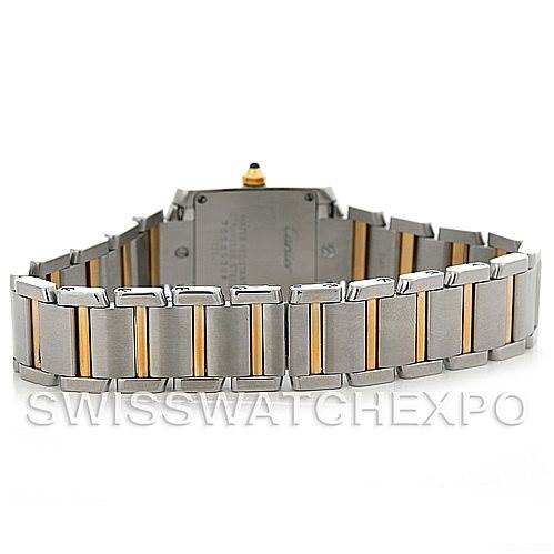 The image shows the rear angle of the Cartier Tank Française watch, highlighting its stainless steel and gold bracelet.