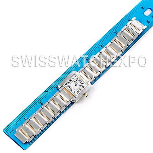 The image shows a Cartier Tank Francaise W51012Q4 Women's Steel and Gold (two tone) Silver Dial W51012Q4 Women's Steel and Gold (two tone) Silver Dial watch laid flat alongside a blue ruler.
