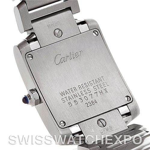 The image shows the back view of the Cartier Tank Française watch, focusing on its stainless steel case and inscriptions.