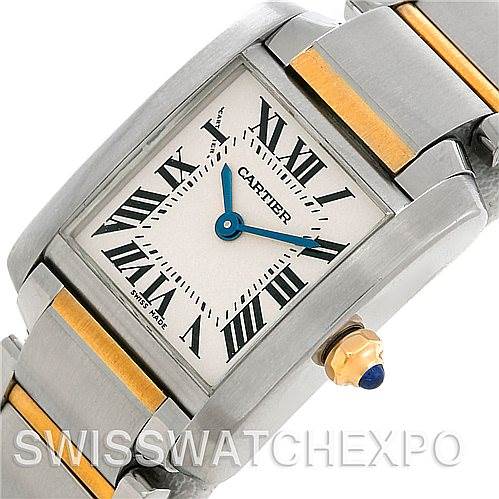 This image shows a close-up of the Cartier Tank Francaise W51007Q4 Women's Steel and Gold (two tone) Silver Dial W51007Q4 Women's Steel and Gold (two tone) Silver Dial watch, highlighting its face, Roman numerals, blue hands, and part of the bracelet.