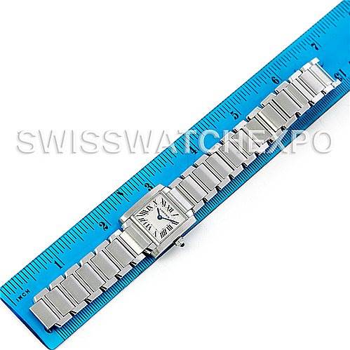 The image shows a full view of a Cartier Tank Francaise W51008Q3 Women's Stainless Steel White Dial W51008Q3 Women's Stainless Steel White Dial watch with its metallic bracelet aligned against a blue ruler.