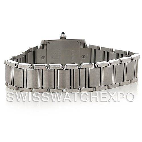 The image shows the backside and bracelet of a Tank Francaise model by Cartier. The brand is mentioned on the image.