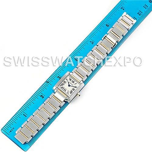 The image shows a Cartier Tank Francaise W51007Q4 Women's Steel and Gold (two tone) Silver Dial W51007Q4 Women's Steel and Gold (two tone) Silver Dial watch lying flat on a blue ruler, displaying its face and bracelet.