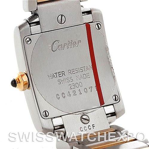 The image shows the back case of a Cartier Tank Francaise W51007Q4 Women's Steel and Gold (two tone) Silver Dial W51007Q4 Women's Steel and Gold (two tone) Silver Dial watch, highlighting the engraved details and part of the bracelet.