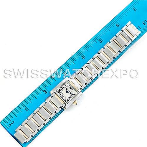 The Cartier Tank Francaise W51007Q4 Women's Steel and Gold (two tone) Silver Dial W51007Q4 Women's Steel and Gold (two tone) Silver Dial watch is shown from a top-down angle, displaying the face and the full metal bracelet alongside a ruler.