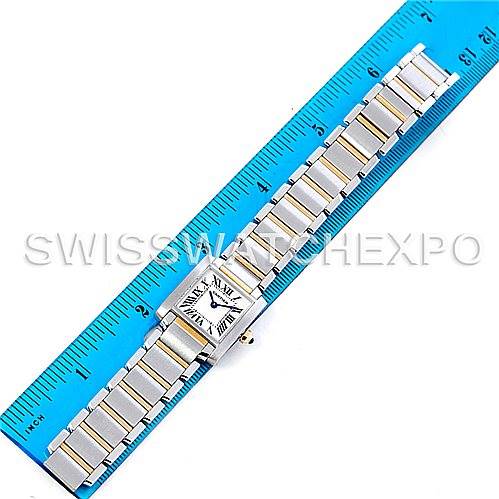 The Cartier Tank Francaise W51007Q4 Women's Steel and Gold (two tone) Silver Dial W51007Q4 Women's Steel and Gold (two tone) Silver Dial watch is shown from a top-down angle, displaying the entire timepiece next to a ruler for scale.