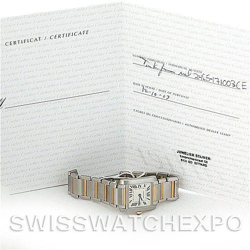 The image shows a Cartier Tank Francaise W51012Q4 Women's Steel and Gold (two tone) Silver Dial W51012Q4 Women's Steel and Gold (two tone) Silver Dial watch positioned in front of its certificate and documentation.