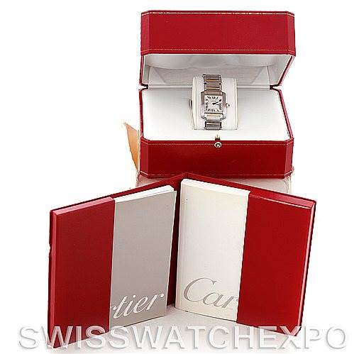 The image shows a Cartier Tank Française watch in an open red box, along with the packaging and manuals.