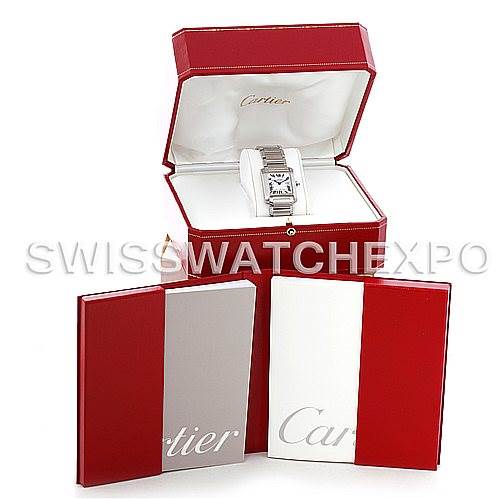 The Cartier Tank Française watch is displayed front-facing in its open box, accompanied by two red booklets.