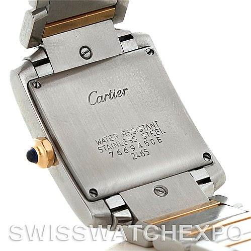 The image shows a close-up of the back and part of the band of a Cartier Tank Française watch, highlighting its water resistance and stainless steel markings.