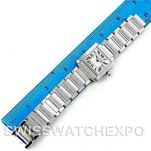 The image shows the full view of a Cartier Tank Francaise W51011Q3 Women's Stainless Steel Silver Dial W51011Q3 Women's Stainless Steel Silver Dial watch, lying flat with a ruler beside it for size reference.