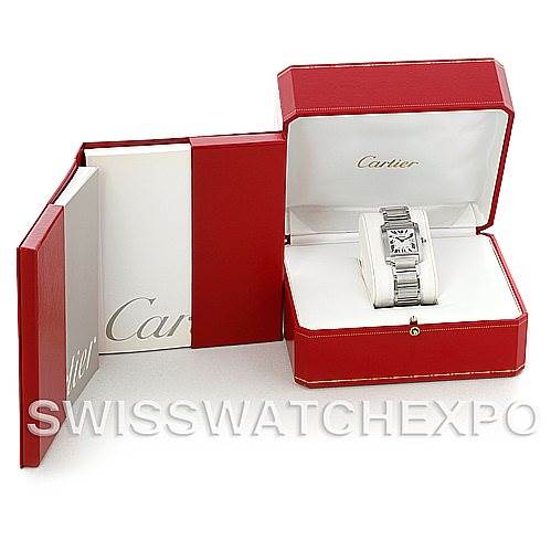 The image shows a Cartier Tank Française watch in a red Cartier box, with the lid open and a booklet beside it.