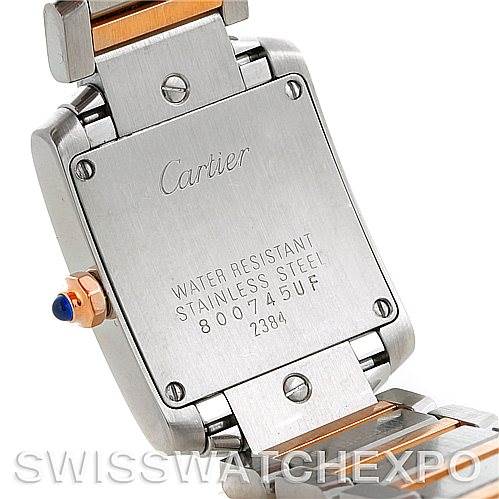 The image shows the back case of the Cartier Tank Francaise W51027Q4 Women's Steel and Gold (two tone) Mother of Pearl Dial W51027Q4 Women's Steel and Gold (two tone) Mother of Pearl Dial watch, highlighting its stainless steel body and engravings.