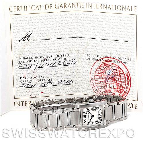 The image shows a Cartier Tank Francaise W51008Q3 Women's Stainless Steel Silver Dial W51008Q3 Women's Stainless Steel Silver Dial watch laid flat with its bracelet visible, along with its warranty certificate in the background.