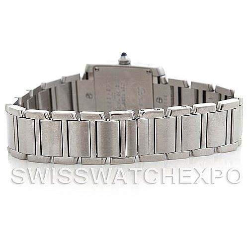 The image shows the back view of a Cartier Tank Française watch, highlighting its stainless steel bracelet and case back.