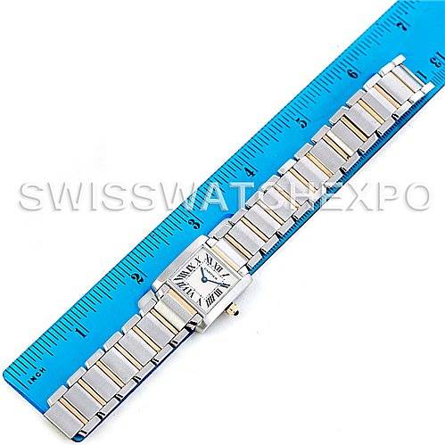 The Cartier Tank Francaise W51007Q4 Women's Steel and Gold (two tone) Silver Dial W51007Q4 Women's Steel and Gold (two tone) Silver Dial watch is shown from a top-down angle, alongside a ruler for scale.