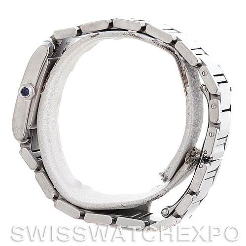 The Tank Francaise by Cartier is shown side-on, displaying the bracelet and the crown with its blue cabochon stone.