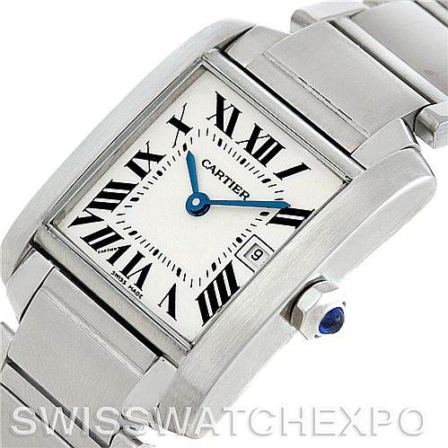The image shows a close-up angle of a Cartier Tank Française watch, highlighting its face, Roman numeral markers, and part of the bracelet.