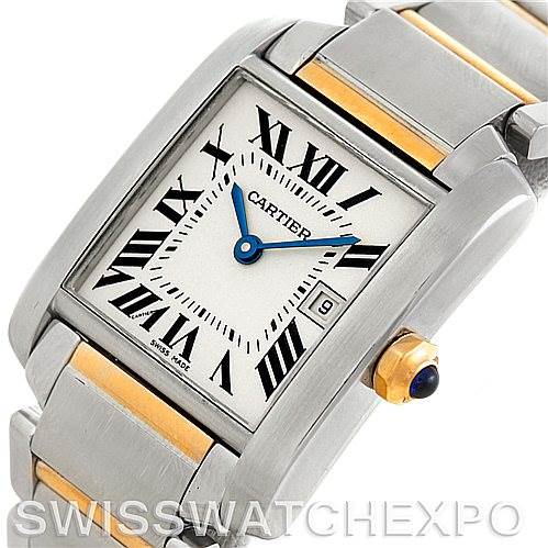 This image shows a close-up of the Cartier Tank Francaise W51012Q4 Women's Steel and Gold (two tone) Silver Dial W51012Q4 Women's Steel and Gold (two tone) Silver Dial watch face and part of the band, revealing its Roman numerals and sapphire crown.